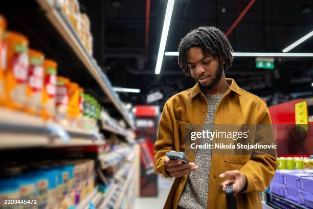 my list is full and i need to buy a lot of things - modern manhood stock pictures, royalty-free photos & images