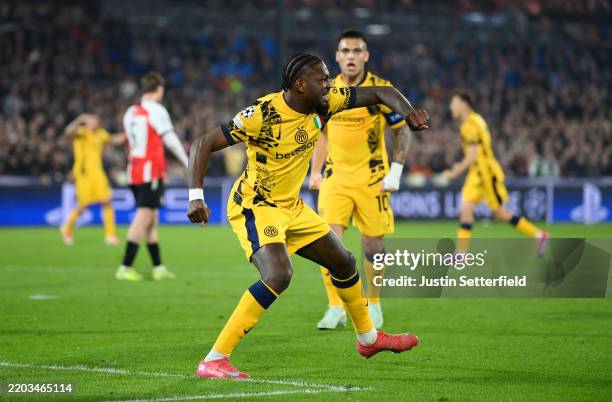 Marcus Thuram of FC Internazionale celebrates scoring his team's first goal during the UEFA Champions League 2024/25 Round of 16 first leg match...