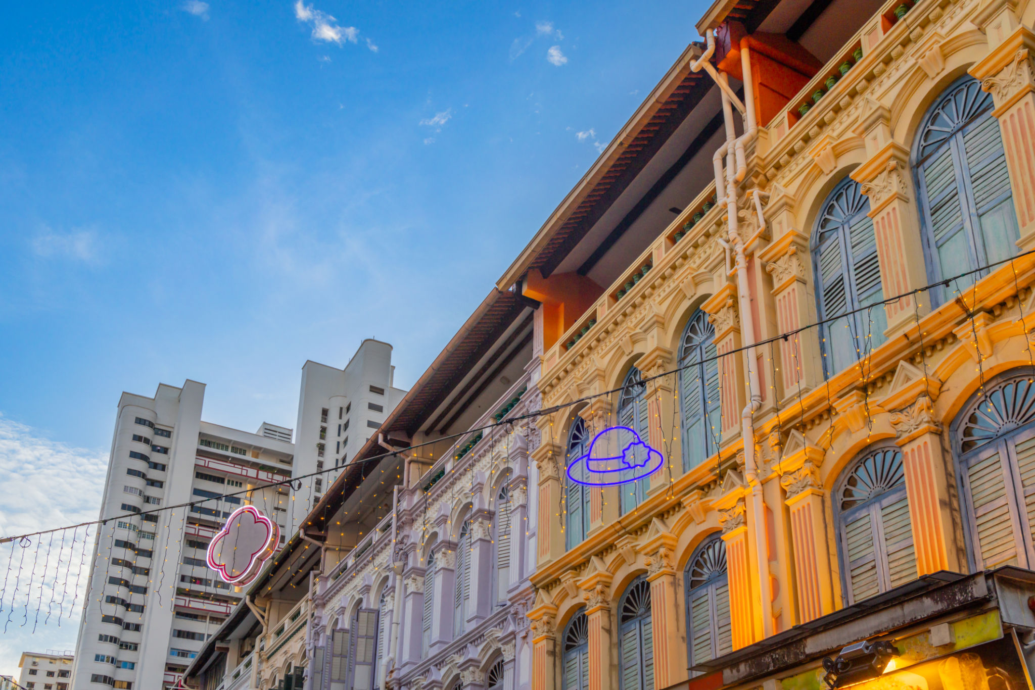Colorful old colonial style houses with modern building in the background, China town, Singapore Colorful old colonial style houses with modern building in the background, China town, Singapore
