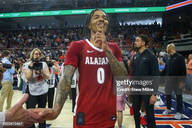 Labaron Philon of the Alabama Crimson Tide gestures to the crowd after defeating the Auburn Tigers in overtime at Neville Arena on March 8, 2025 in...