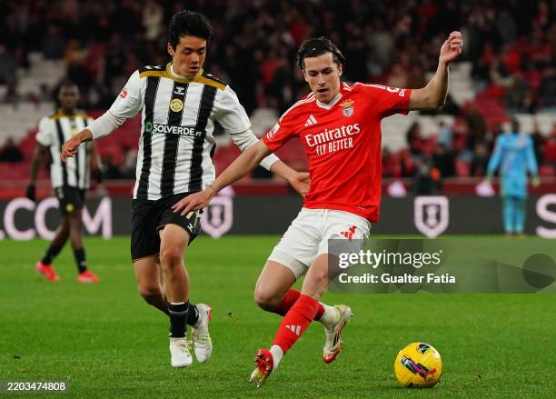 Alvaro Carreras of SL Benfica with Fuki Yamada of CD Nacional in action during the Liga Portugal Betclic match between SL Benfica and CD Nacional at...