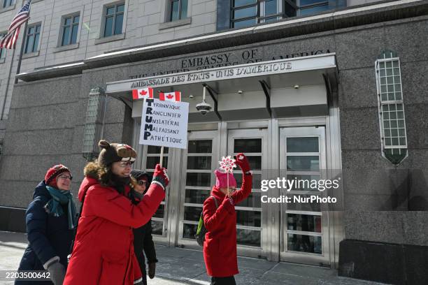 Protesters gather outside the U.S. Embassy for the 'Ottawa Ensemble pour Nos Filles' demonstration, organized by Mothers Out Front on International...