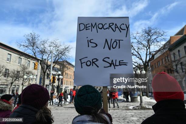 Protesters gather next to the U.S. Embassy for the 'Ottawa Ensemble pour Nos Filles' demonstration, organized by Mothers Out Front on International...