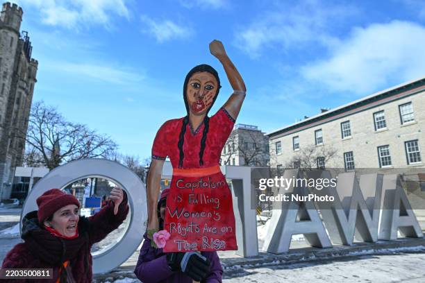 Protesters gather next to the U.S. Embassy for the 'Ottawa Ensemble pour Nos Filles' demonstration, organized by Mothers Out Front on International...