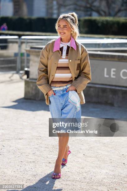 Emili Sindlev wears beige jacket, denim jeans shorts, striped brown polo outside Casablanca during the Womenswear Fall/Winter 2025/2026 as part of...