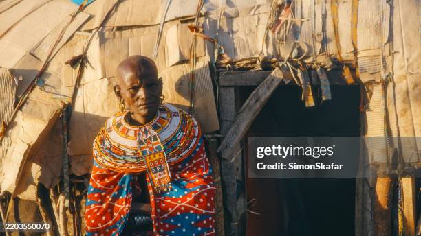 traditional samburu tribe member wearing beaded jewelry near village home - shack stock pictures, royalty-free photos & images