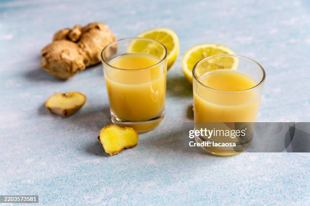 ginger shot - shot glass stock pictures, royalty-free photos & images