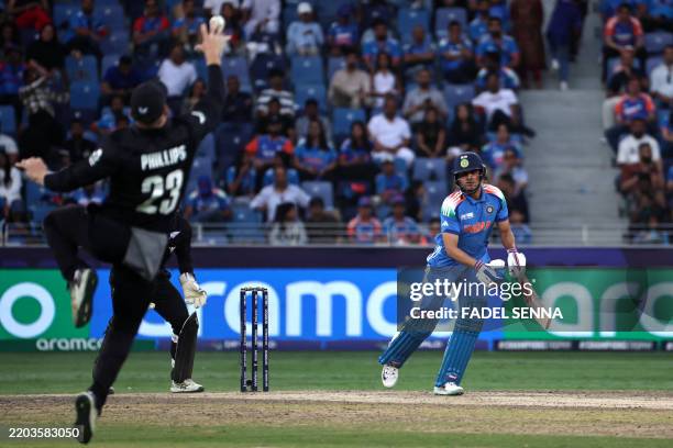 New Zealand's Glenn Phillips takes the catch to dismiss India's Shubman Gill during the ICC Champions Trophy one-day international final cricket...