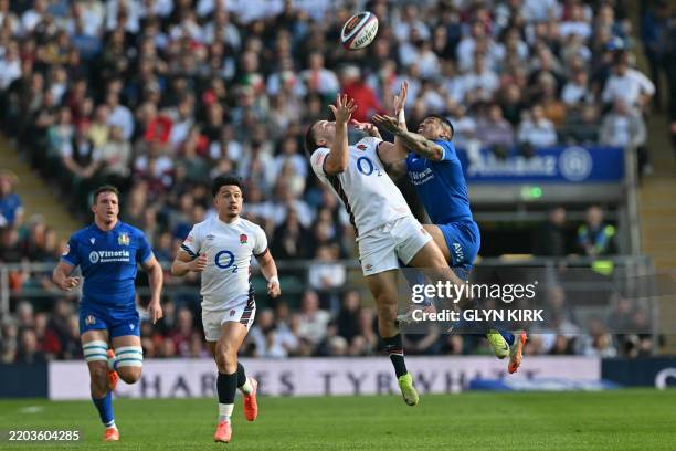 England's wing Ollie Sleightholme and Italy's wing Monty Ioane compete for a high ball during the Six Nations international rugby union match between...
