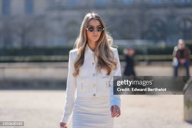 Guest wears black sunglasses, cream multicolor buttoned Casablanca blazer jacket, outside Casablanca, during the Paris Fashion week Women's...