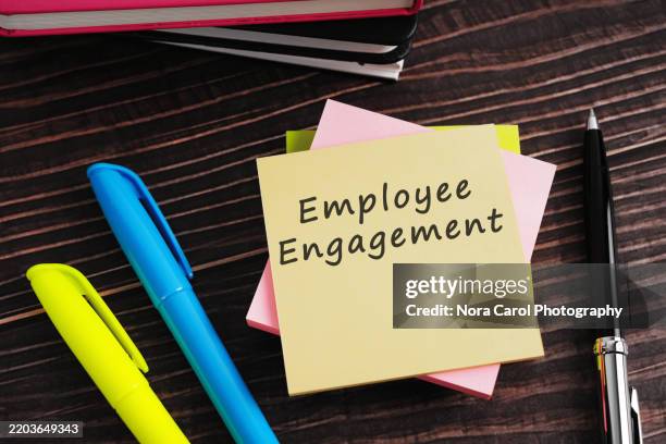 employee engagement text on adhesive note - employee engagement stock pictures, royalty-free photos & images