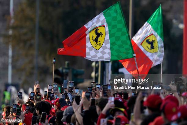 Fans of Scuderia Ferrari attend the Scuderia Ferrari F1 event to meet Charles Leclerc of Monaco and Lewis Hamilton of Great Britain at Piazza...