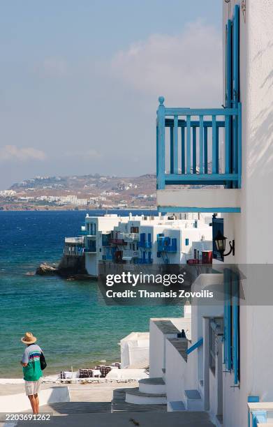 picturesque coastal view with blue balconies in mykonos - archipel des cyclades photos et images de collection