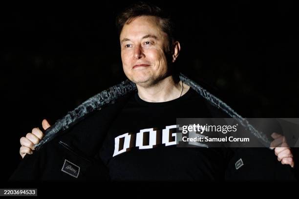 White House Senior Advisor Elon Musk walks to the White House after landing in Marine One on the South Lawn with U.S. President Donald Trump on March...