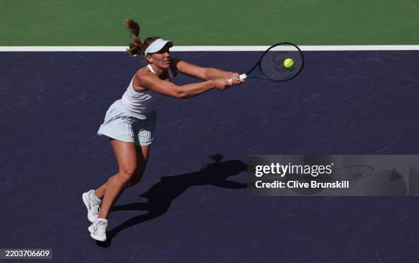 Maddison Inglis of Australia plays a backhand against Sofia Kenin of the United States in their first round match during the BNP Paribas Open at...