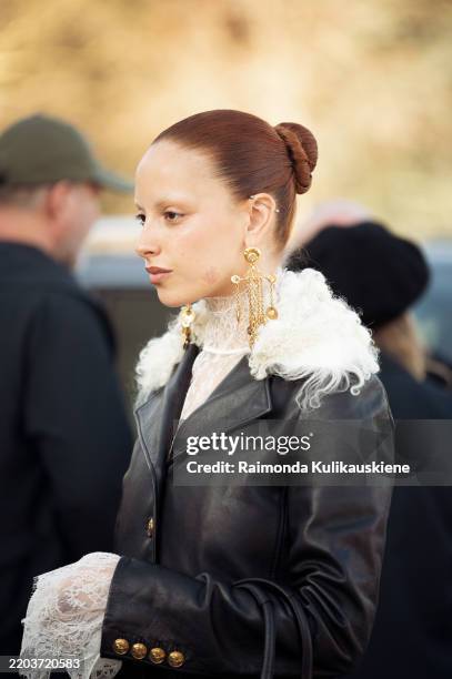 Marie Gaguech wears white lace top, black leather jacket with white fur collar outside the Chloe fashion show during the Womenswear Fall/Winter...