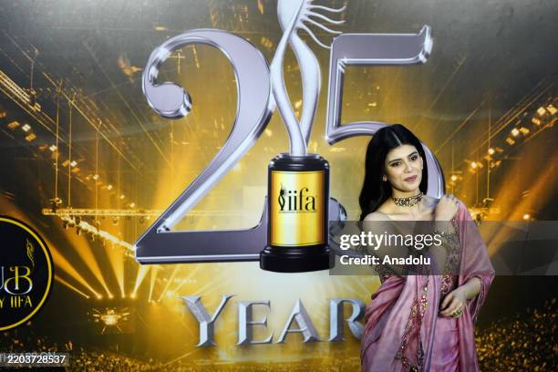 Indian Bollywood actress Sanjana Sanghi poses on the green carpet to attend the Silver Jubilee edition of the International Indian Film Academy...