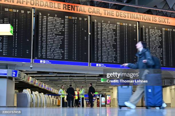 Passengers wait at Frankfurt Airport on March 10, 2025 in Frankfurt, Germany. Verdi, which is seeking wage increases from airport employers, has...