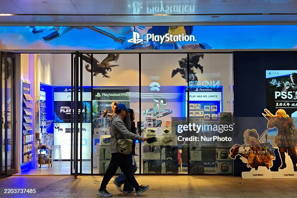 Console Store Pedestrians pass a Sony PlayStation game console store in Shanghai ...