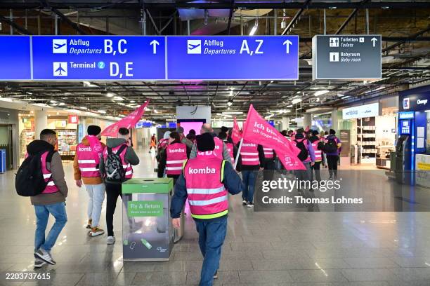 Striking airport workers gather with banners of the Komba labour union at Frankfurt Airport on March 10, 2025 in Frankfurt, Germany. Verdi, which is...