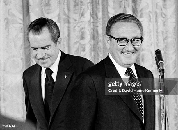 President Richard Nixon congratulates newly appointed Secretary of State Henry Kissinger September 22, 1973 in Washington D.C. Kissinger's oath as...