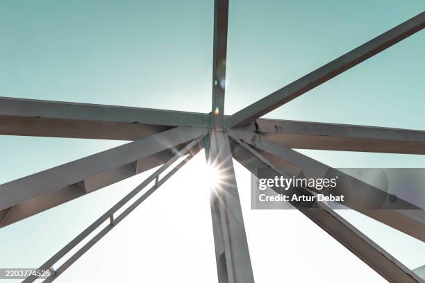 a complex union of a truss frame with the sunlight - timber frames stock pictures, royalty-free photos & images