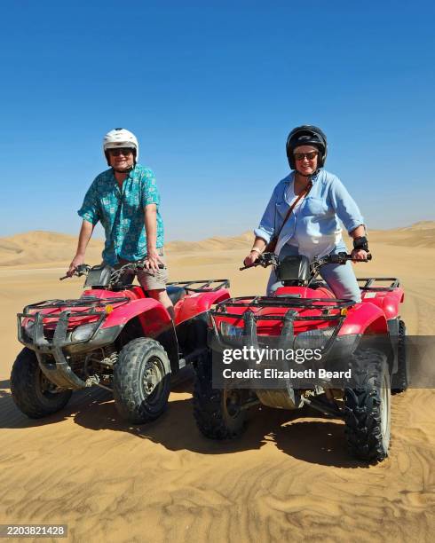 couple quad biking in namib desert - swakopmund namibia stock pictures, royalty-free photos & images