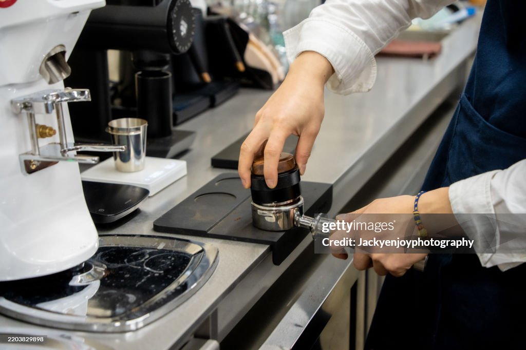An employee of a coffee establishment