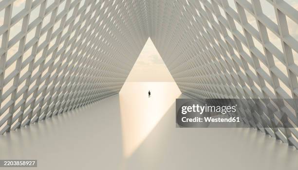 man standing in sunlight amidst modern structure - abandoned stock illustrations