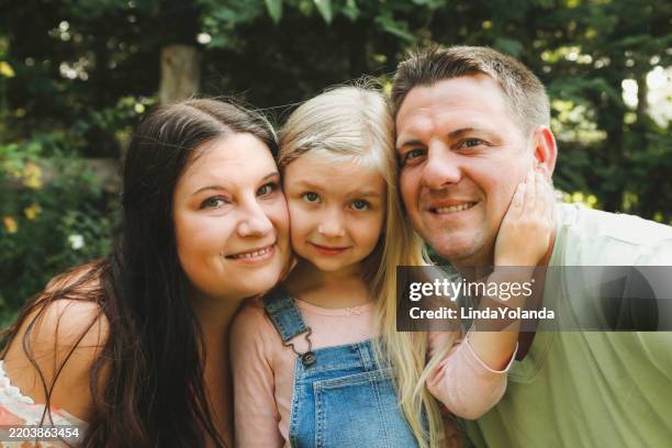 family in garden - eye color stock pictures, royalty-free photos & images