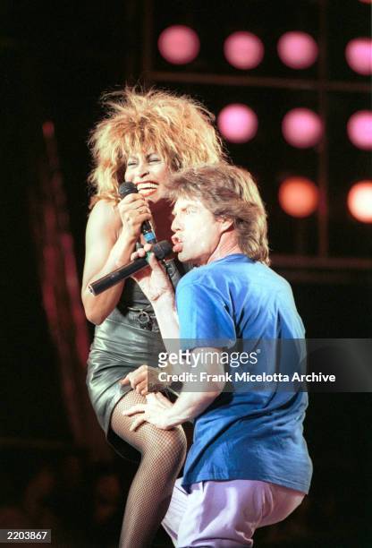 Tina Turner and Mick Jagger perform for a sold out crowd at the Live Aid concert at JFK Stadium in Philadelphia, Pennsylvania, July 13, 1985. Jagger...