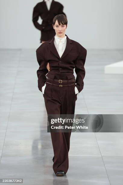 Model walks the runway during the Issey Miyake Womenswear Fall/Winter 2025-2026 show as part of Paris Fashion at Le Carrousel du Louvre on March 07,...