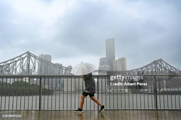 Local residents exercise on March 08, 2025 in Brisbane, Australia. Australia's east coast is experiencing severe weather as ex-Tropical Cyclone...