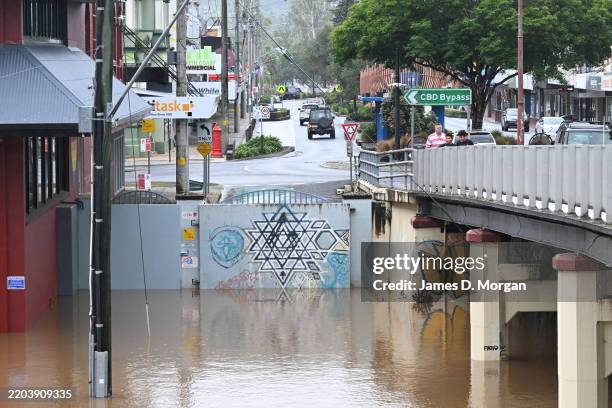 Flood levee walls holding back the water on the Wilsons River in the CBD on March 08, 2025 in Lismore, Australia. Ex-Cyclone Alfred has now been...