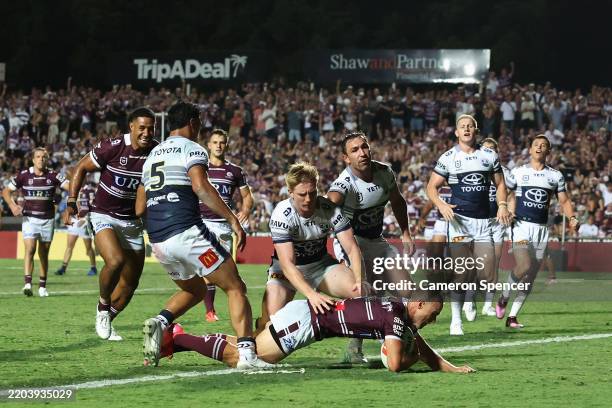 Daly Cherry-Evans of the Sea Eagles scores a try during the round one NRL match between Manly Sea Eagles and North Queensland Cowboys at 4 Pines...