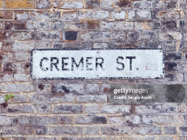 cremer street sign - western script stock pictures, royalty-free photos & images