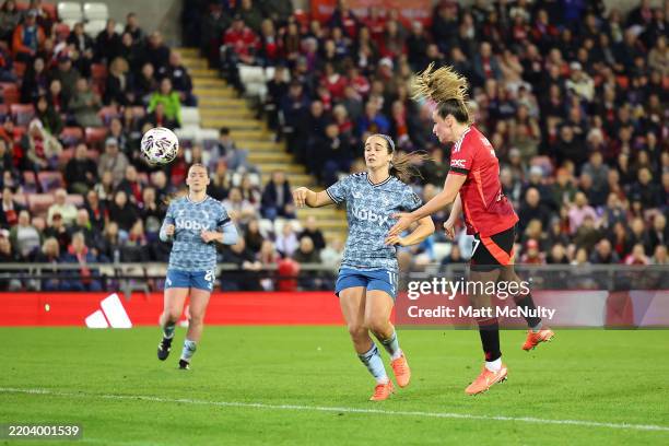 Ella Toone of Manchester United scores her team's third goal whilst under pressure from Natasha Fenton of Sunderland during The Adobe Women's FA Cup...