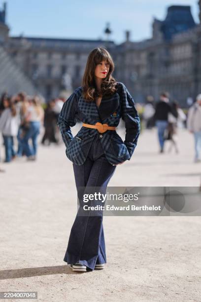 Marion Felicite wears navy blue pattern/print oversized denim jean Vivienne Westwood blazer jacket, light brown heart leather belt, navy blue denim...