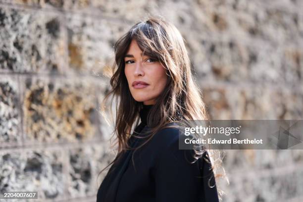 Alison Toby wears black scarf, black oversized blazer jacket, outside Nina Ricci, during the Paris Fashion week Women's Fall/Winter 2025-2026 on...