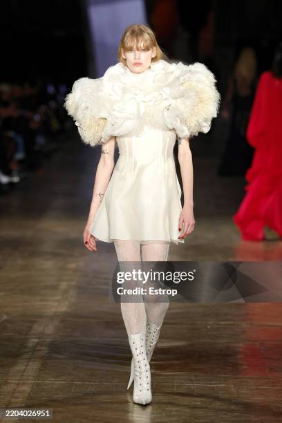 Model walks the runway during the Alexander McQueen Womenswear Fall/Winter 2025-2026 show as part of Paris Fashion Week at Galerie de Mineralogie of...