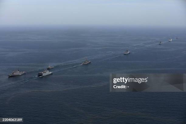 This handout photo made available by the Iranian Army Office on March 12, 2025 shows navy vessels taking part in a joint Iranian-Russian-Chinese...