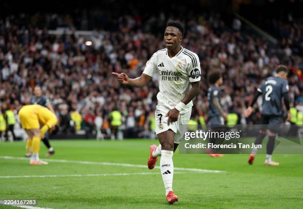 Vinicius Junior of Real Madrid celebrates scoring his team's second goal during the LaLiga match between Real Madrid CF and Rayo Vallecano at the...