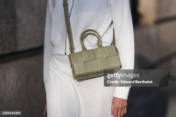 Izabel Sim wears dark olive green woven leather bag, outside Elie Saab, during the Paris Fashion week Women's Fall/Winter 2025-2026 on March 8, 2025...