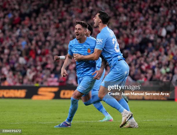 Antonio Raillo of RCD Mallorca celebrates scoring his team's first goal with teammate Martin Valjent during the LaLiga match between Athletic Club...