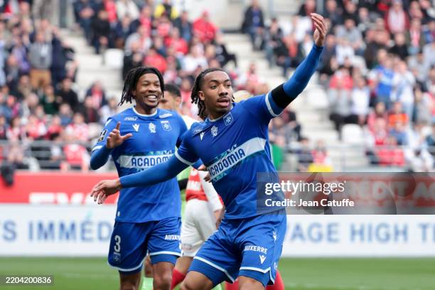 Thelonius Theo Bair of Auxerre celebrates his goal with Gabriel Osho during the Ligue 1 football match between Stade de Reims and AJ Auxerre at Stade...