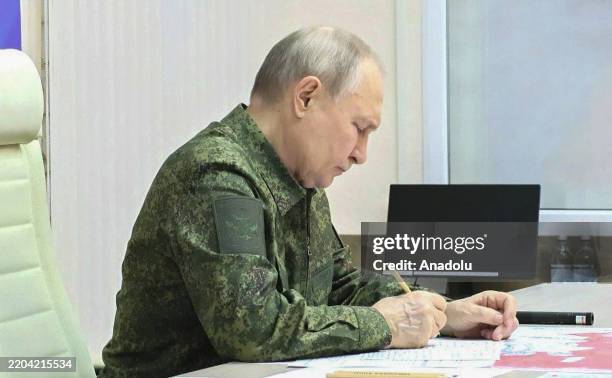 Screen grab from a video shows Russian President Vladimir Putin, dressed in military uniform, visited a command post in Kursk, Russia on March 12,...