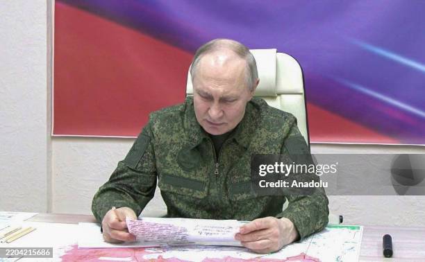 Screen grab from a video shows Russian President Vladimir Putin, dressed in military uniform, visited a command post in Kursk, Russia on March 12,...