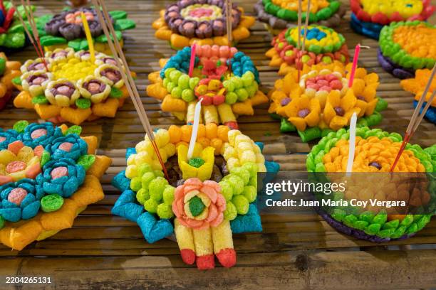 beautifully crafted krathongs made from colourful puffed rice and fish food, arranged on a bamboo surface. these vibrant floating offerings are used during the thai festival of loi krathong, especially in chiang mai. thailand - thai food stock pictures, royalty-free photos & images