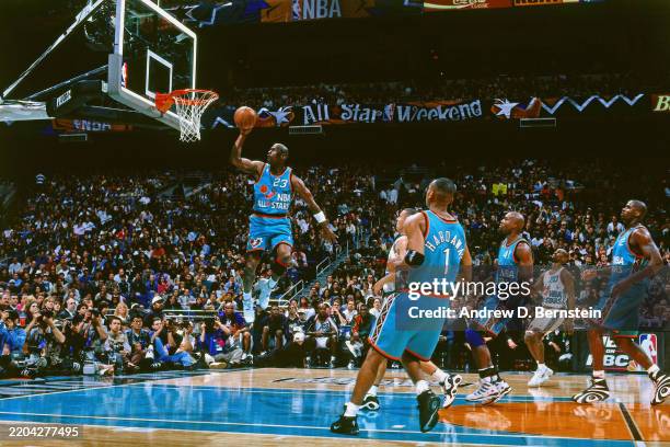 Michael Jordan of the Eastern Conference All-Stars dunks against the Western Conference All Stars during the 1996 NBA All-Star game played February...