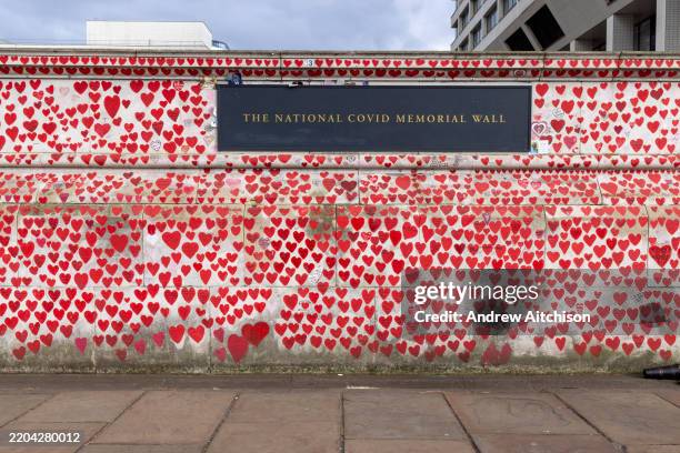 The National Covid Memorial Wall, five years since the outbreak of COVID, a sea of red love hearts remembering all those who have died due to the...